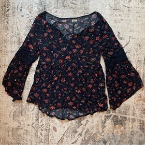 Navy and red floral print blouse with bell sleeves and lace detailing